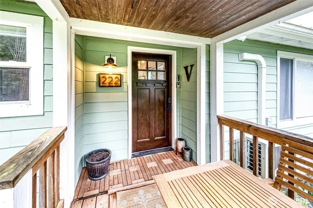 a view of a house with deck and wooden floor