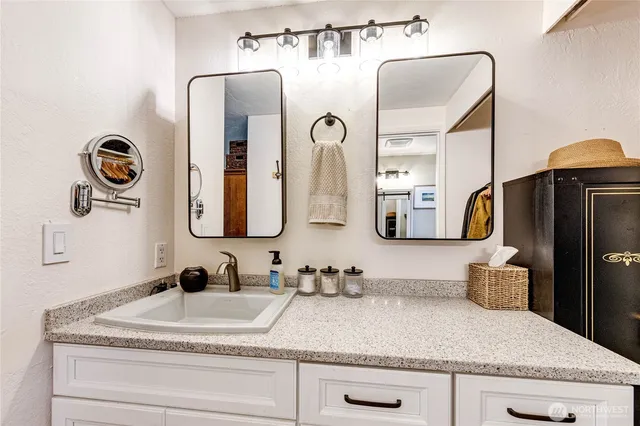 a bathroom with a sink and a mirror