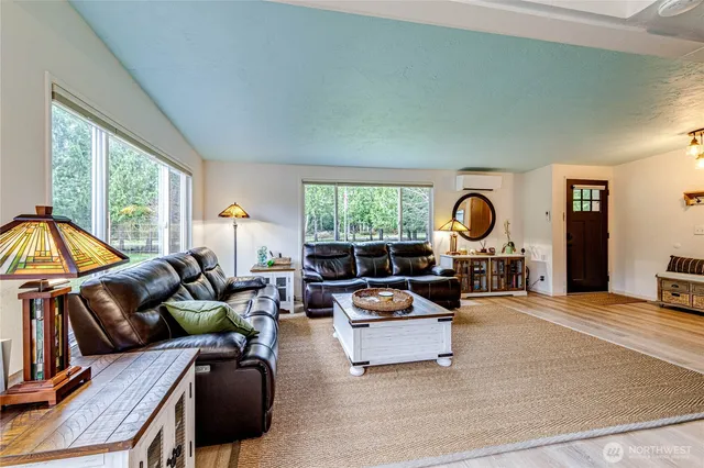 a living room with furniture and a large window