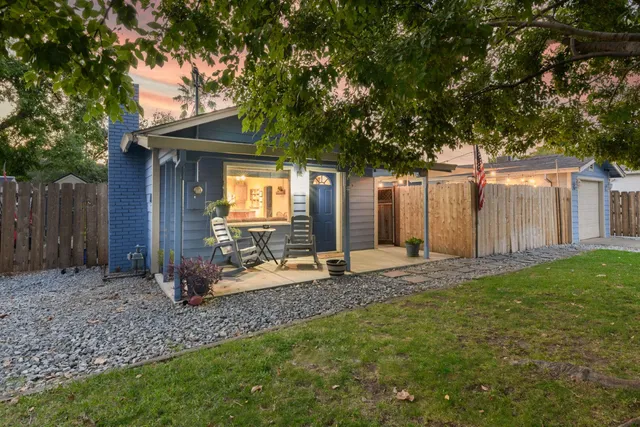 a backyard of a house with seating space