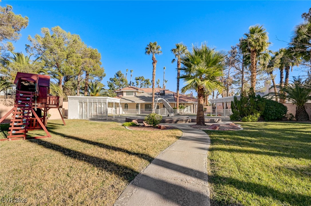 2955 El Camino Road Las Vegas, NV 89146 - Photo 94 of 99 Surrounding community featuring a yard and a playground