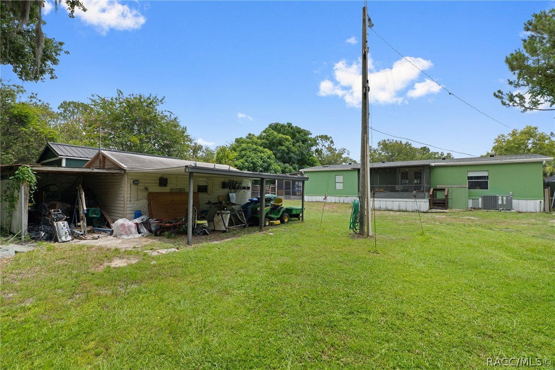 7927 West Cyprian Court Homosassa, FL 34448 - Photo 35 of 40 a view of a house with backyard