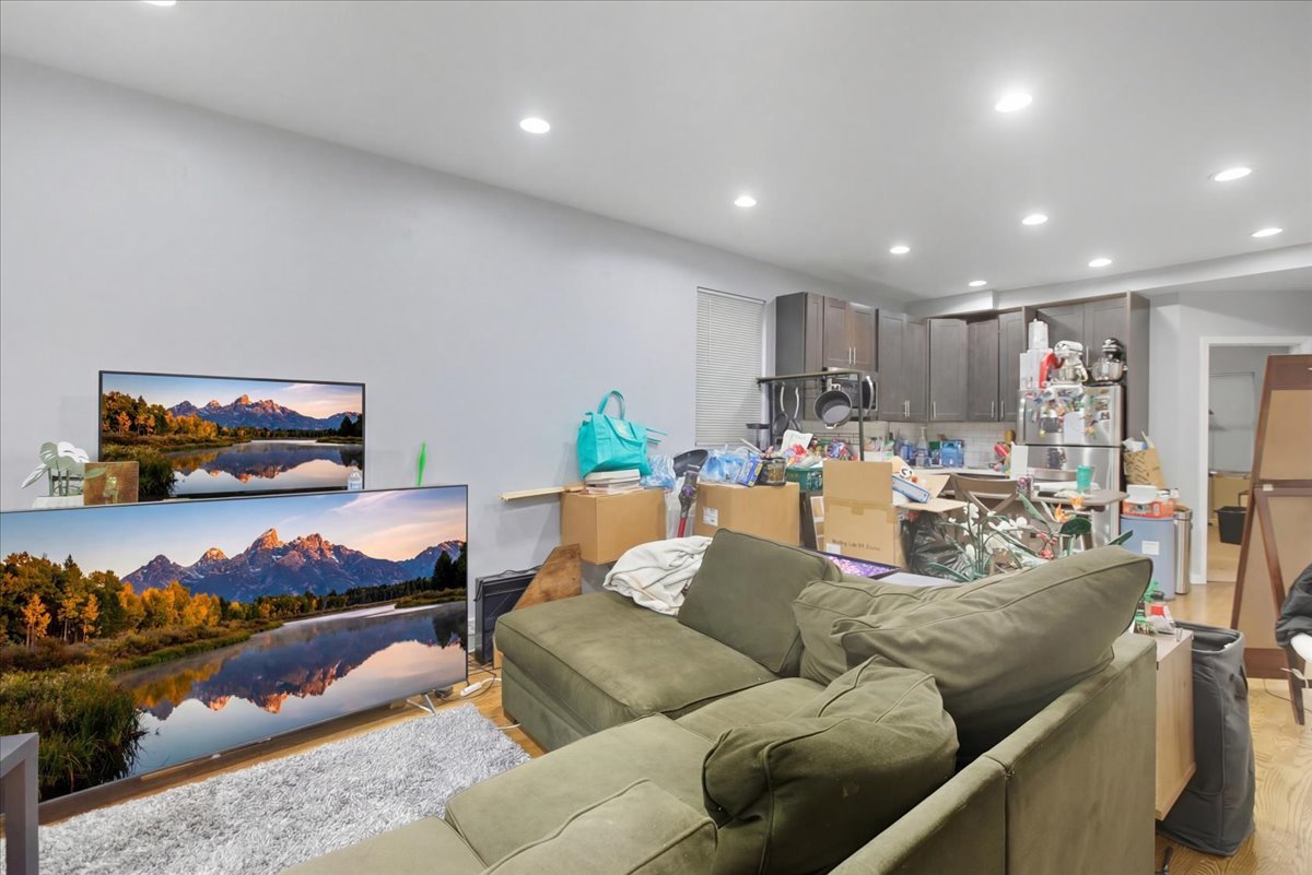 518 North May Street, Unit 1 Chicago, IL 60642 - Photo 3 of 10 a living room with furniture and a view of kitchen