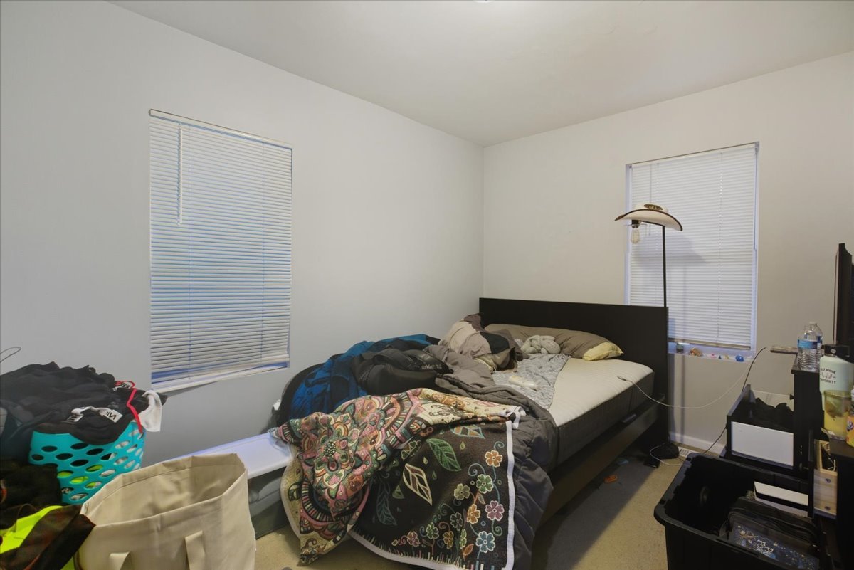 518 North May Street, Unit 1 Chicago, IL 60642 - Photo 7 of 10 a bed sitting in a bedroom next to a window