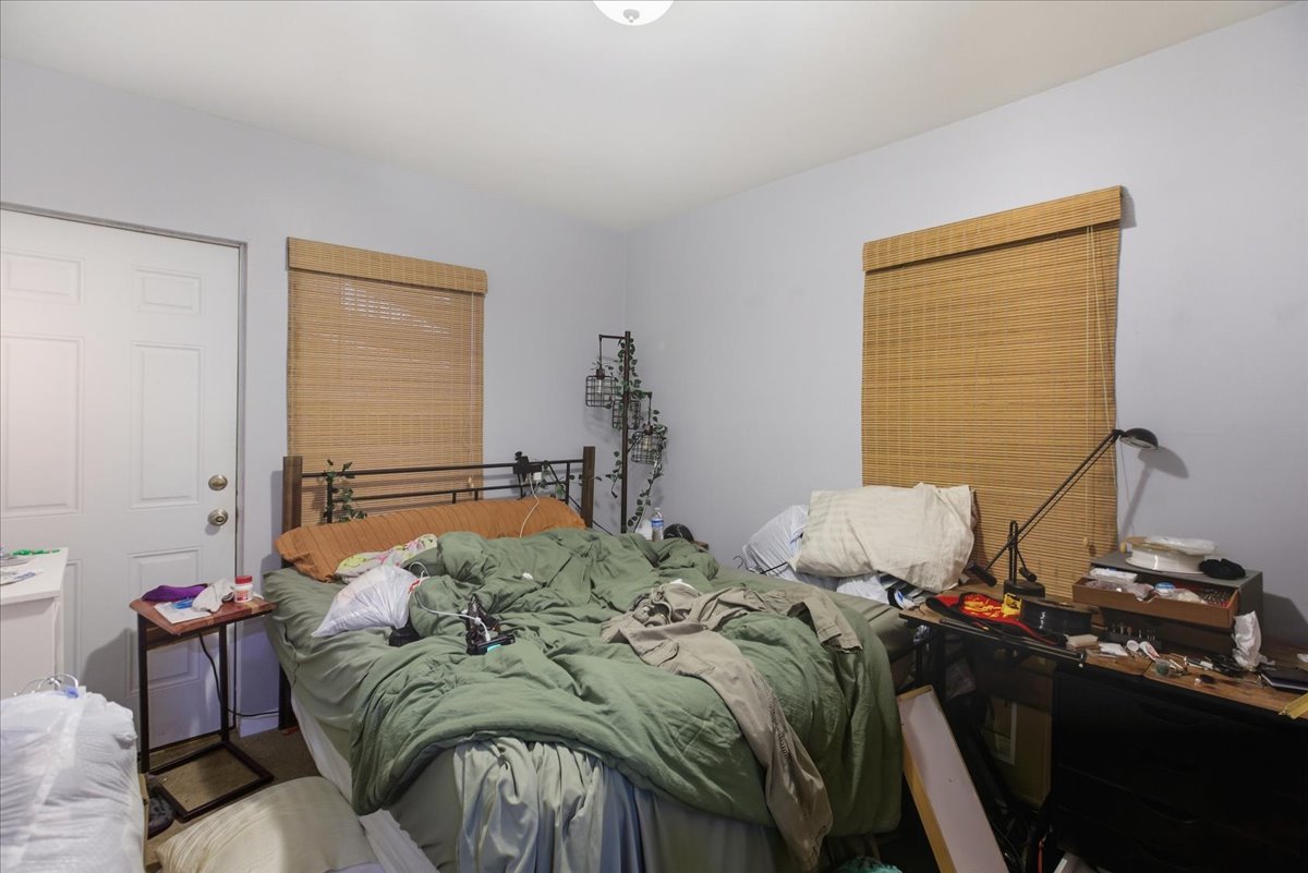 518 North May Street, Unit 1 Chicago, IL 60642 - Photo 8 of 10 a bed sitting in a bedroom next to a window