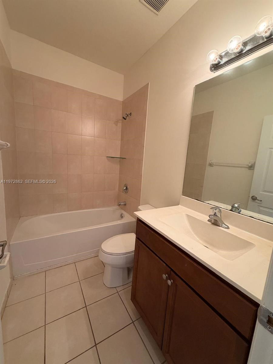 11520 Southwest 248th Lane Homestead, FL 33032 - Photo 12 of 15 a bathroom with a sink a toilet and shower