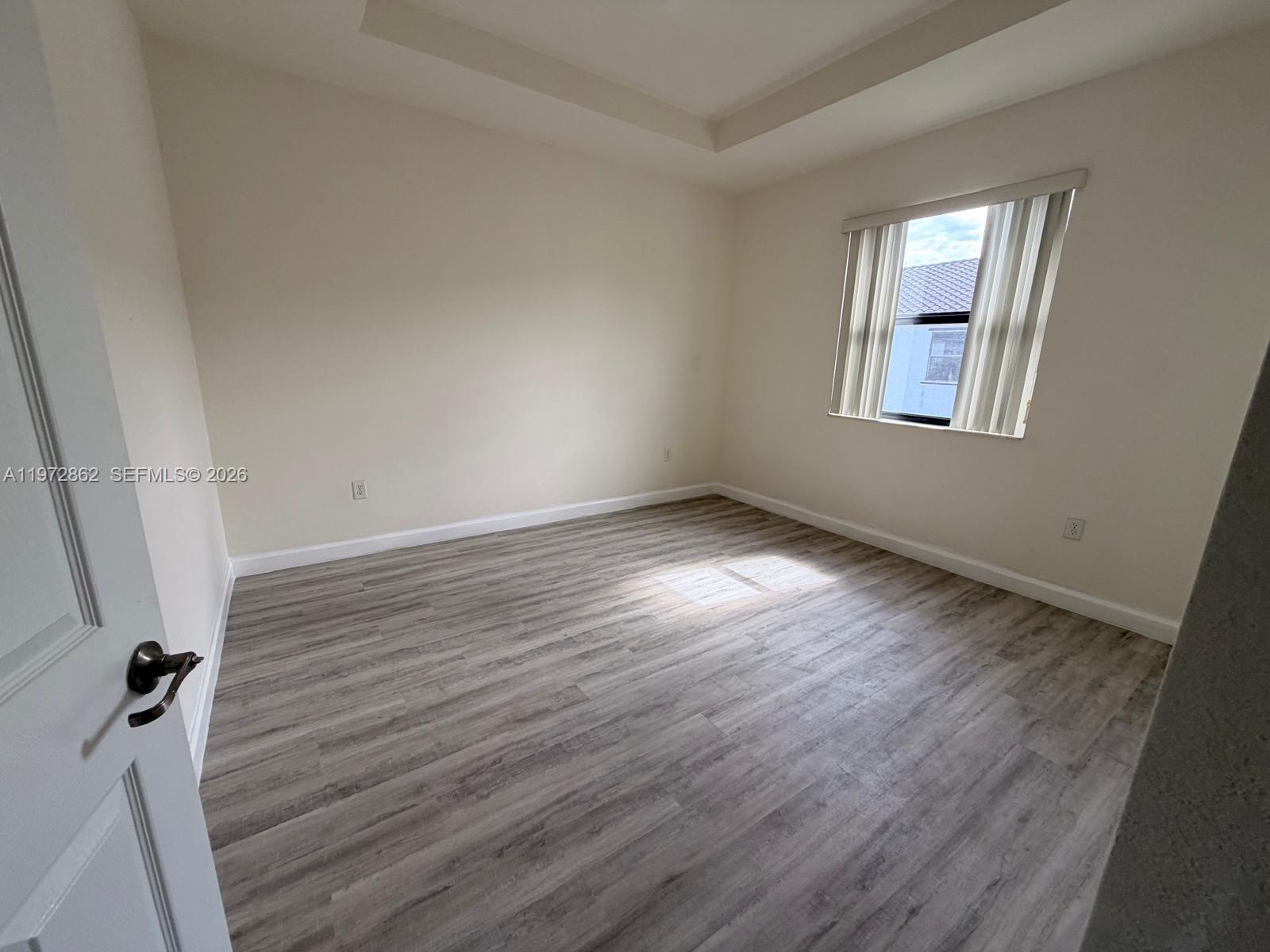 11520 Southwest 248th Lane Homestead, FL 33032 - Photo 14 of 15 wooden floor in an empty room