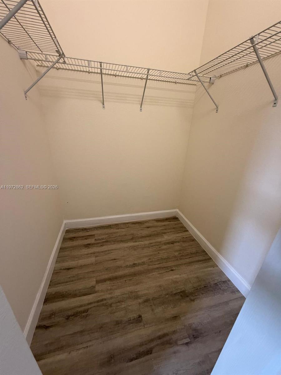 11520 Southwest 248th Lane Homestead, FL 33032 - Photo 8 of 15 a view of a room with racks on the wall