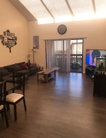 a view of a workspace with furniture and a potted plant