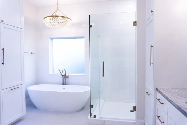 a spacious bathroom with a bathtub and shower