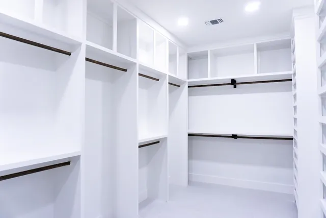 a view of an empty walk in closet