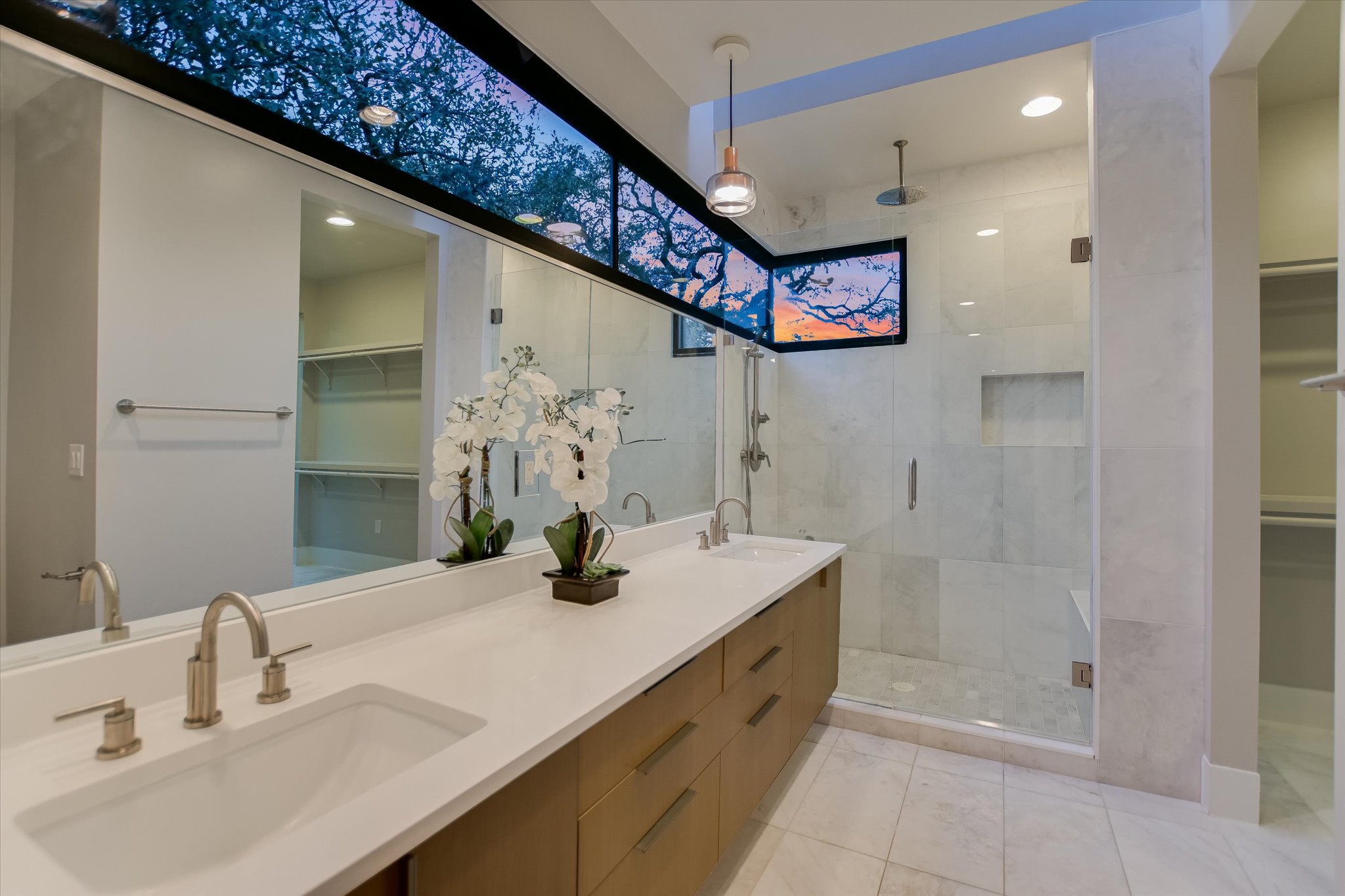 1325 Bonham Terrace, Unit A Austin, TX 78704 - Photo 16 of 25 a bathroom with a sink a shower and a mirror