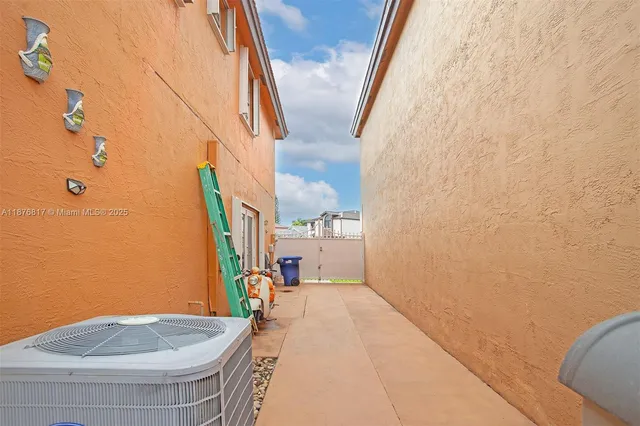 a view of backyard with a barn and a cactus plant