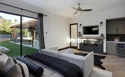 a bedroom with bed and a couch