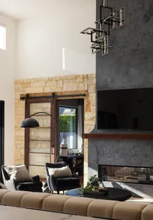 a living room with furniture or couch and a chandelier