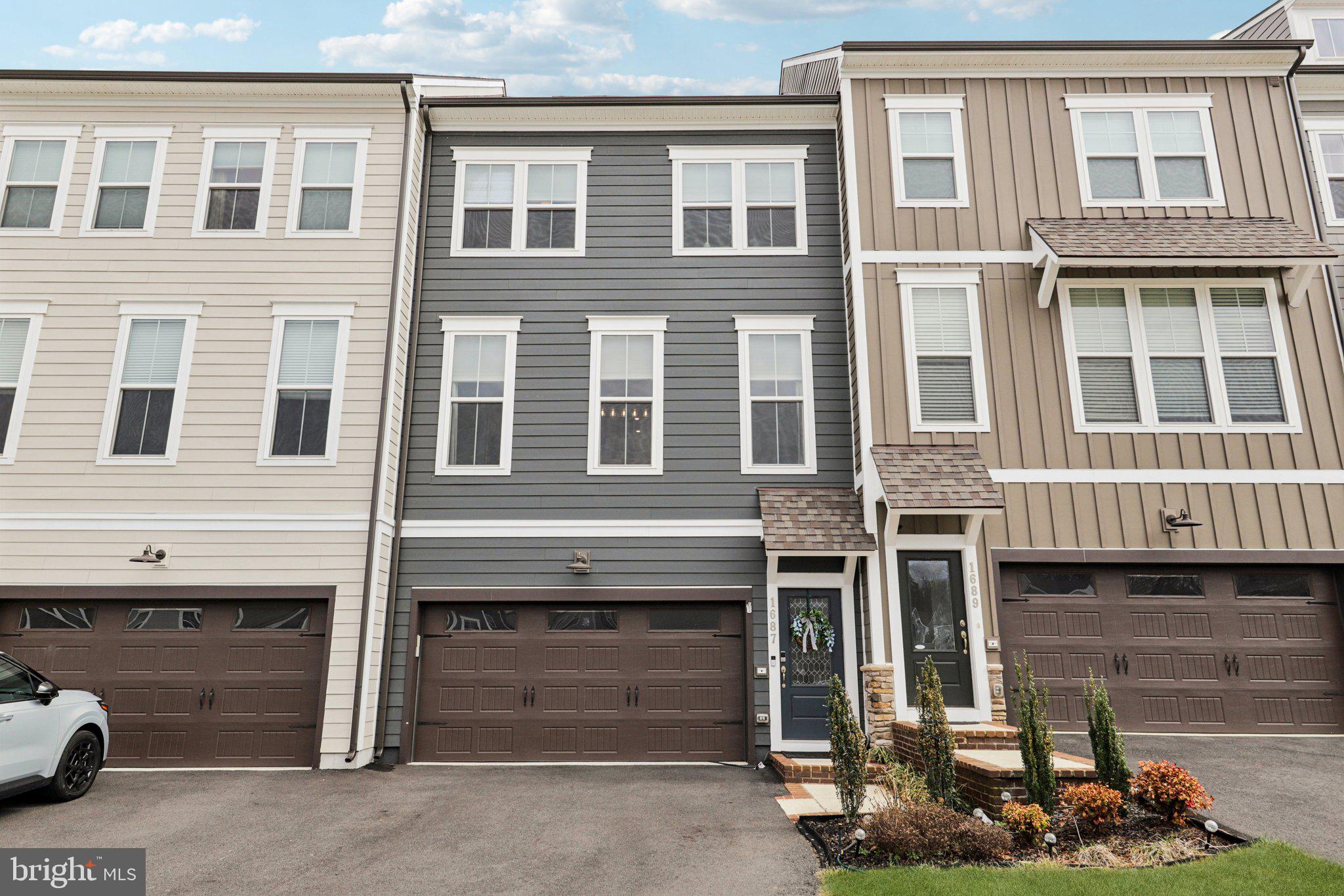 1687 Aspen Poplar Road Dumfries, VA 22026 - Photo 1 of 69 a front view of a house with a yard