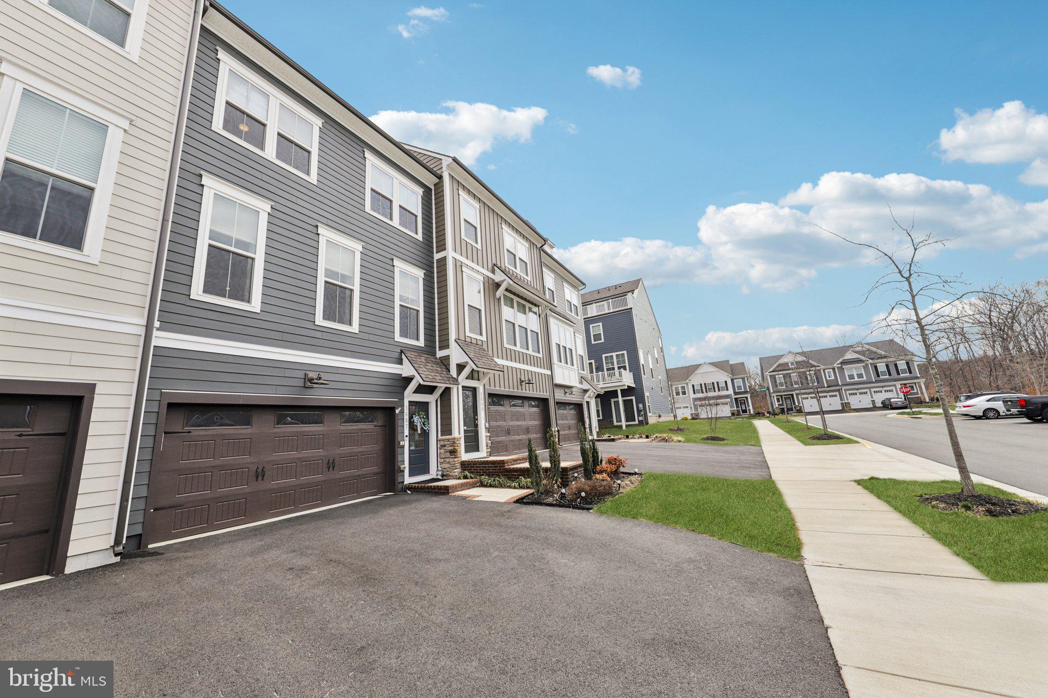 1687 Aspen Poplar Road Dumfries, VA 22026 - Photo 2 of 69 a view of a street with buildings in the background