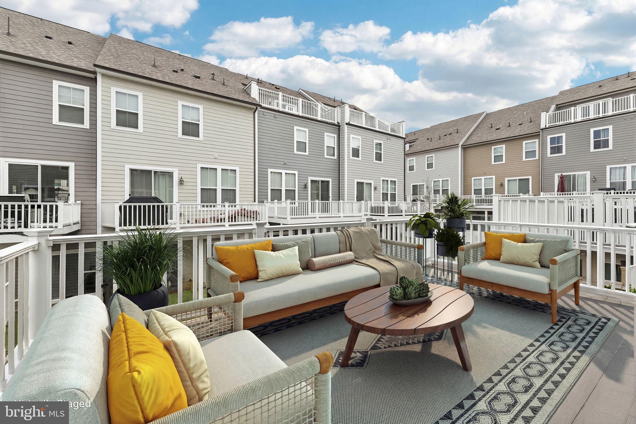 1687 Aspen Poplar Road Dumfries, VA 22026 - Photo 22 of 69 a view of a patio with couches chairs and potted plants