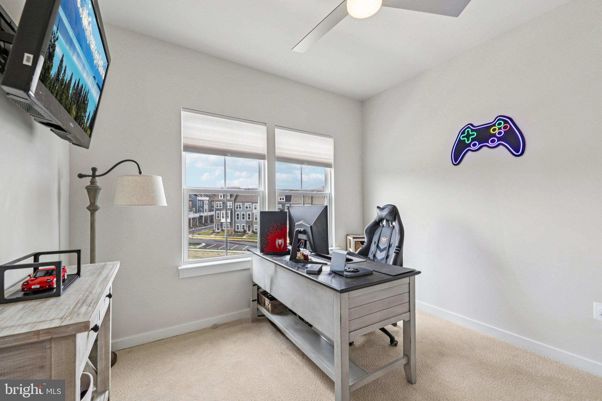 1687 Aspen Poplar Road Dumfries, VA 22026 - Photo 36 of 69 a view of a workspace with furniture and a window