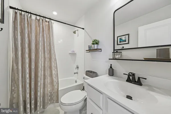 a front view of a building with glass windows and walls