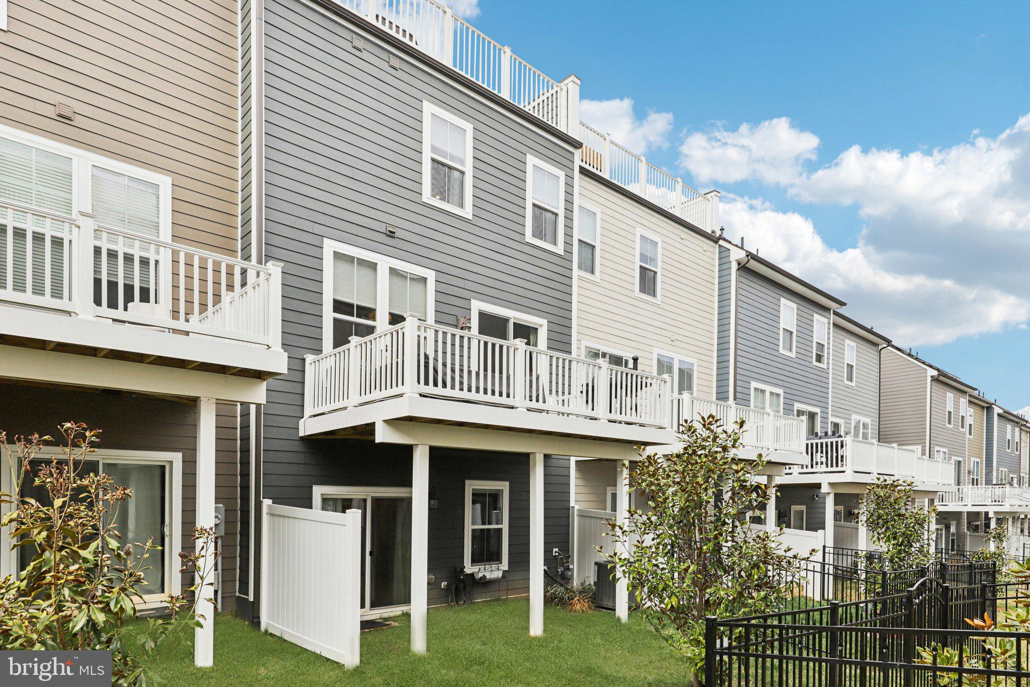 1687 Aspen Poplar Road Dumfries, VA 22026 - Photo 56 of 69 a front view of a building with glass windows and walls