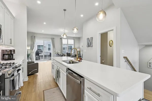 a view of a livingroom with furniture window and wooden floor