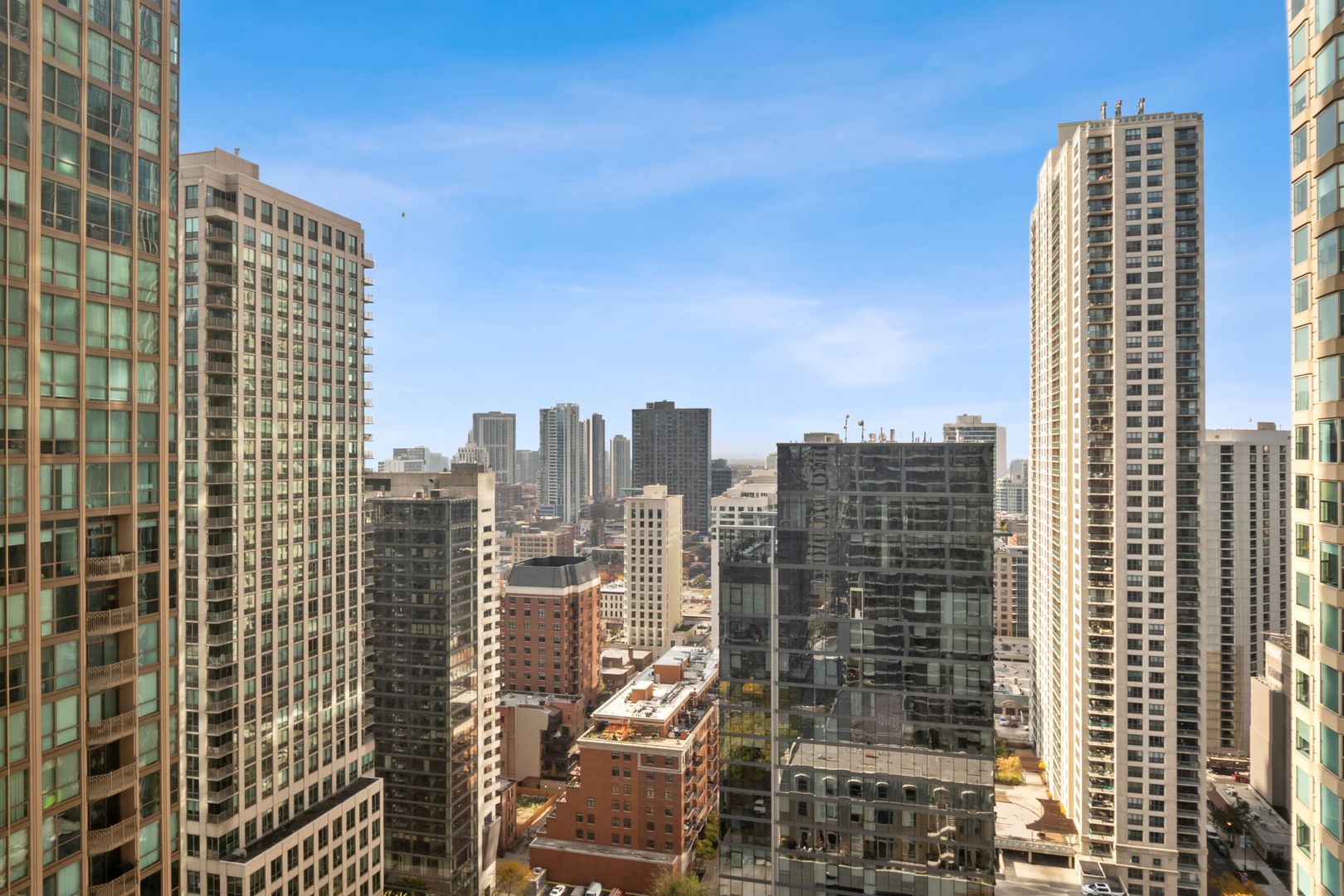 30 East Huron Street, Unit 3005 Chicago, IL 60611 - Photo 12 of 21 a city view with tall buildings