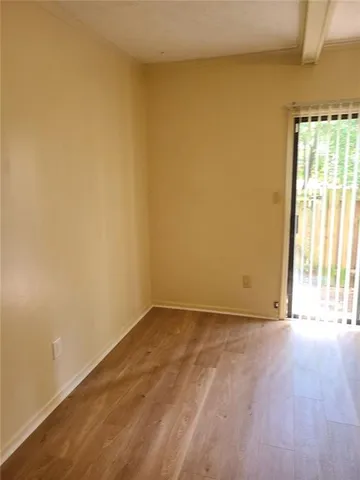 a view of an empty room and window