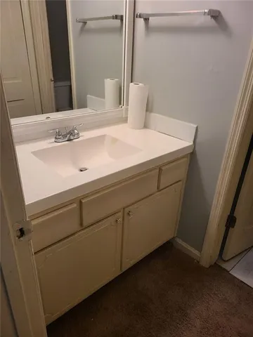 a close up of a sink and a mirror