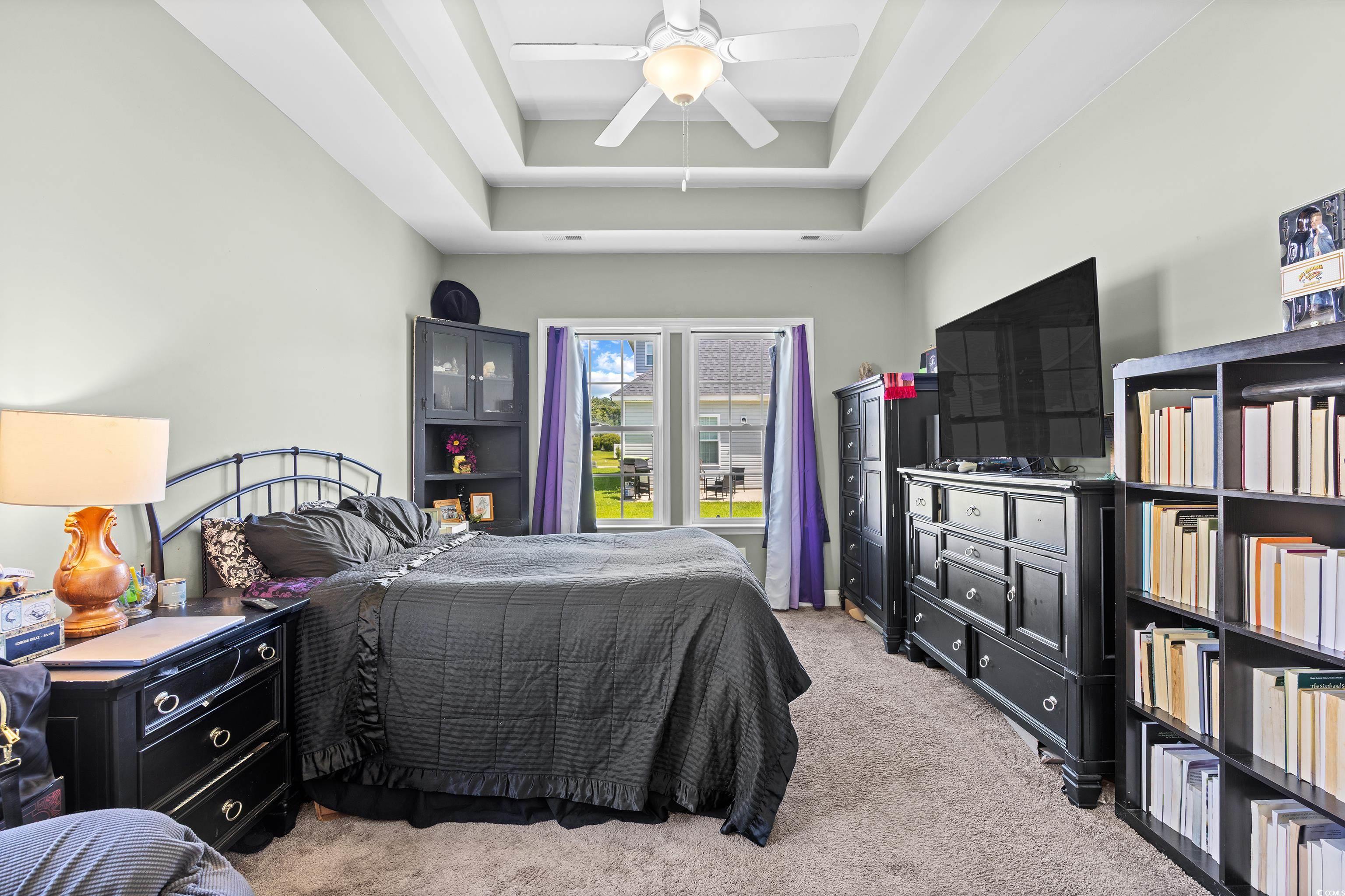 704 Hobonny Loop Longs, SC 29568 - Photo 17 of 36 Bedroom featuring light carpet, ceiling fan, and a