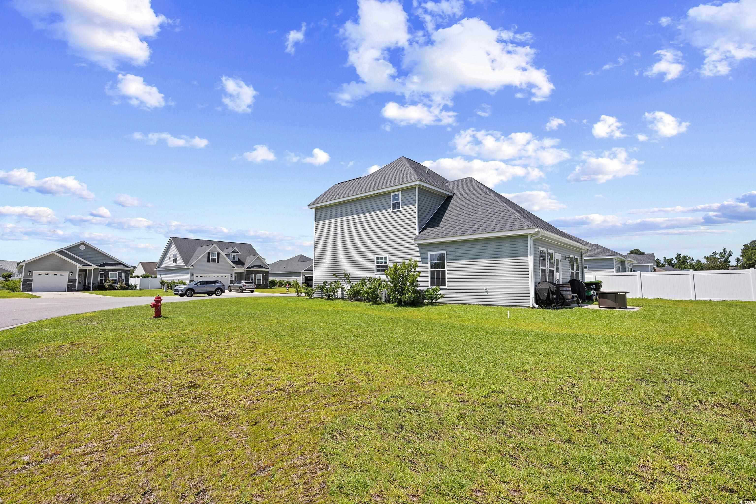 704 Hobonny Loop Longs, SC 29568 - Photo 31 of 36 View of side of property with roof with shingles