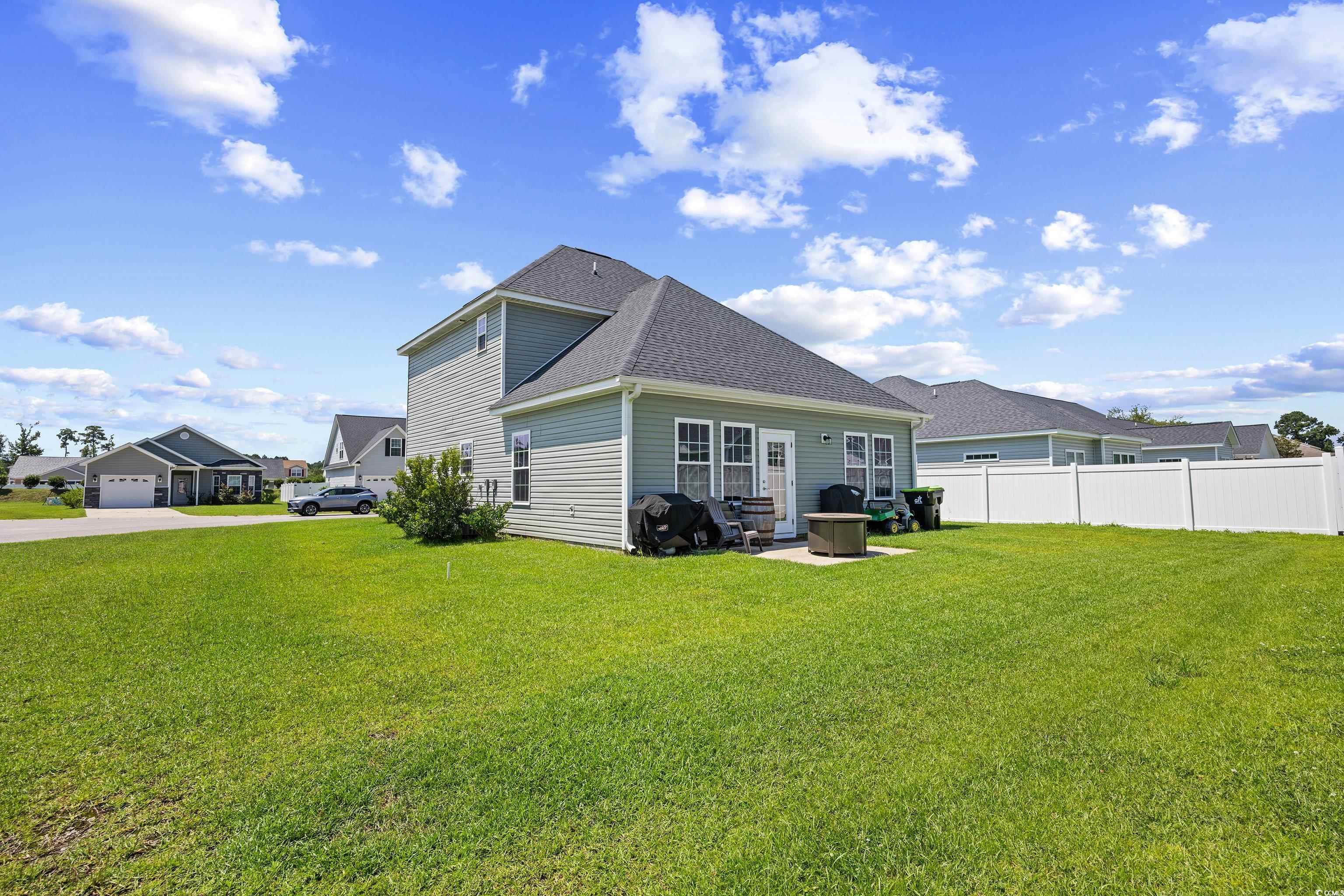 704 Hobonny Loop Longs, SC 29568 - Photo 35 of 36 Rear view of property with a shingled roof