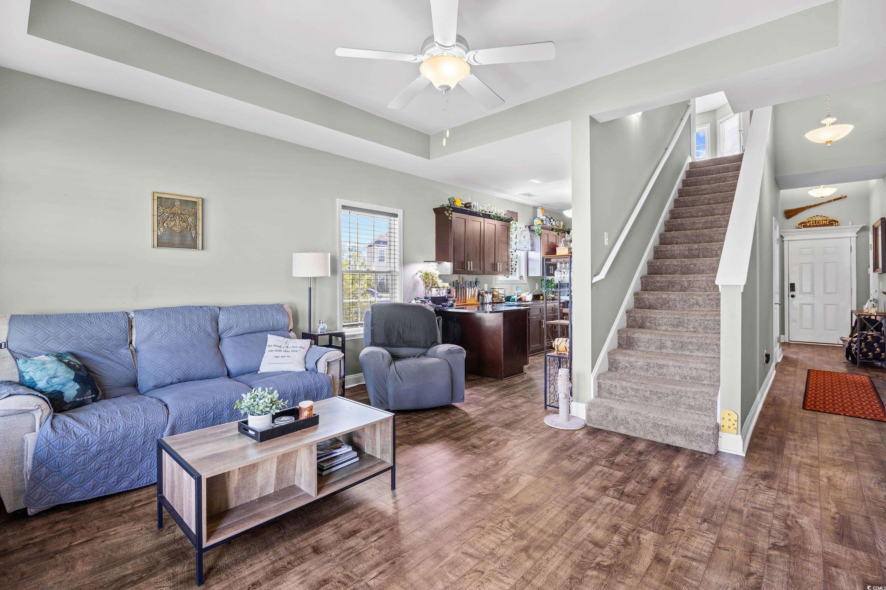704 Hobonny Loop Longs, SC 29568 - Photo 5 of 36 Living area featuring dark wood-style floors, stai