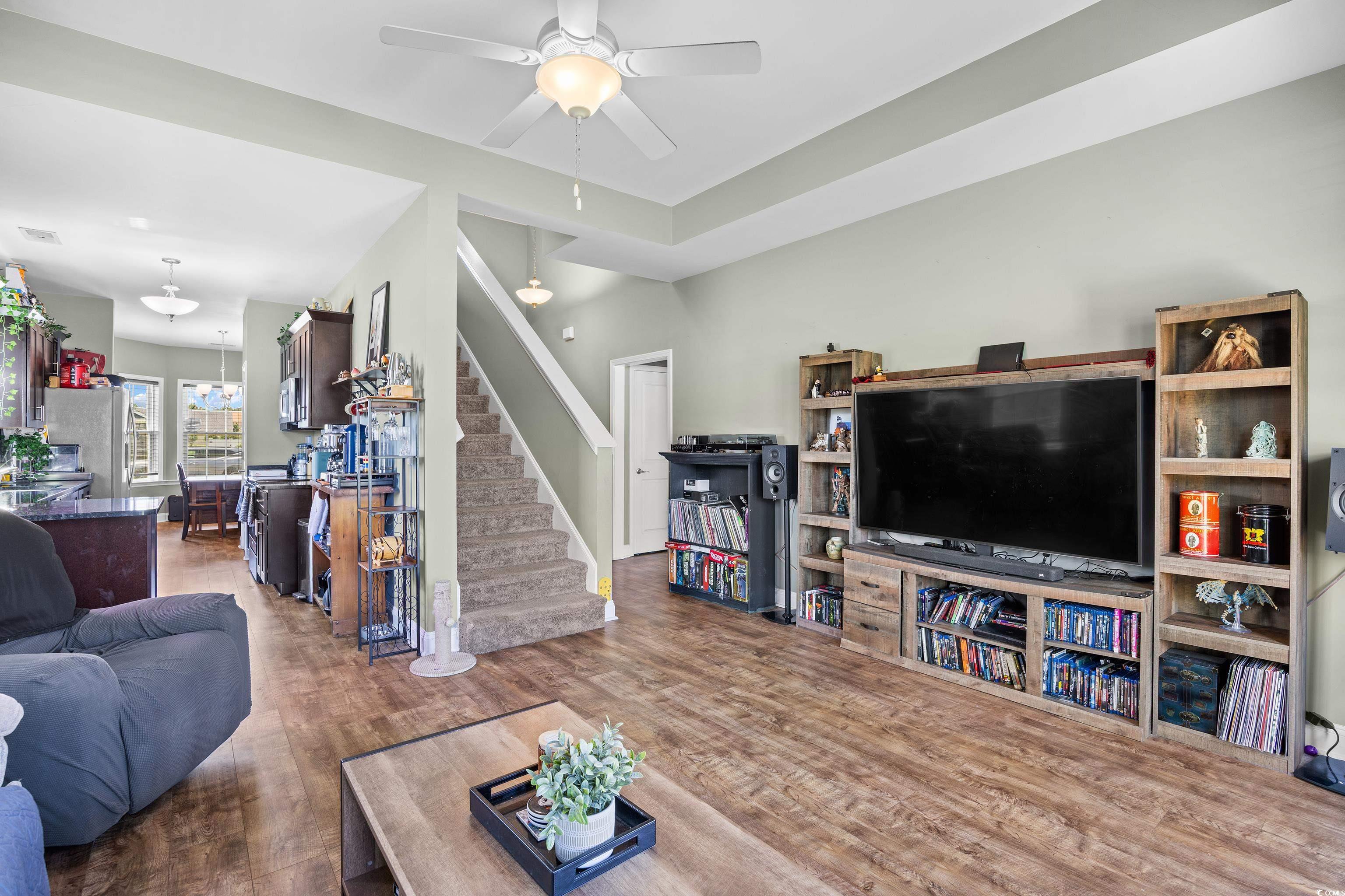 704 Hobonny Loop Longs, SC 29568 - Photo 6 of 36 Living room featuring stairs, wood finished floors