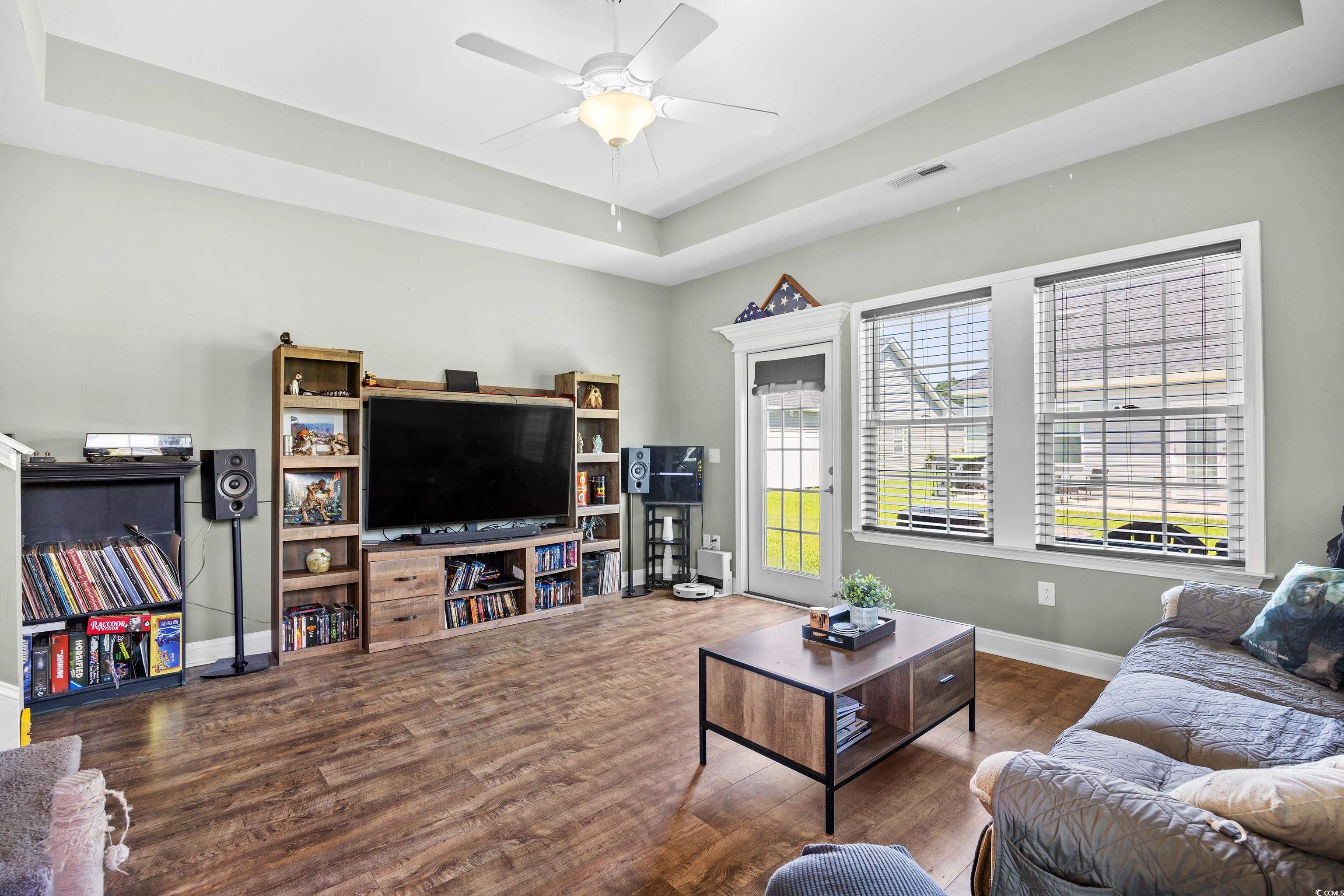 704 Hobonny Loop Longs, SC 29568 - Photo 7 of 36 Living room featuring a raised ceiling, wood finis
