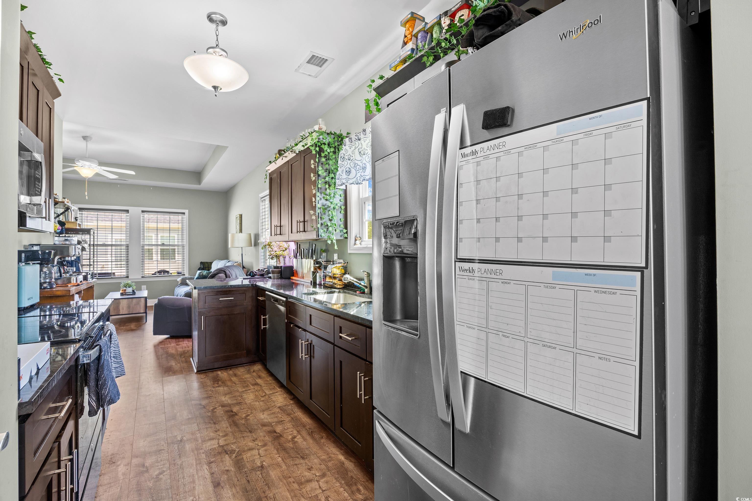 704 Hobonny Loop Longs, SC 29568 - Photo 10 of 36 Kitchen with stainless steel appliances, open floo