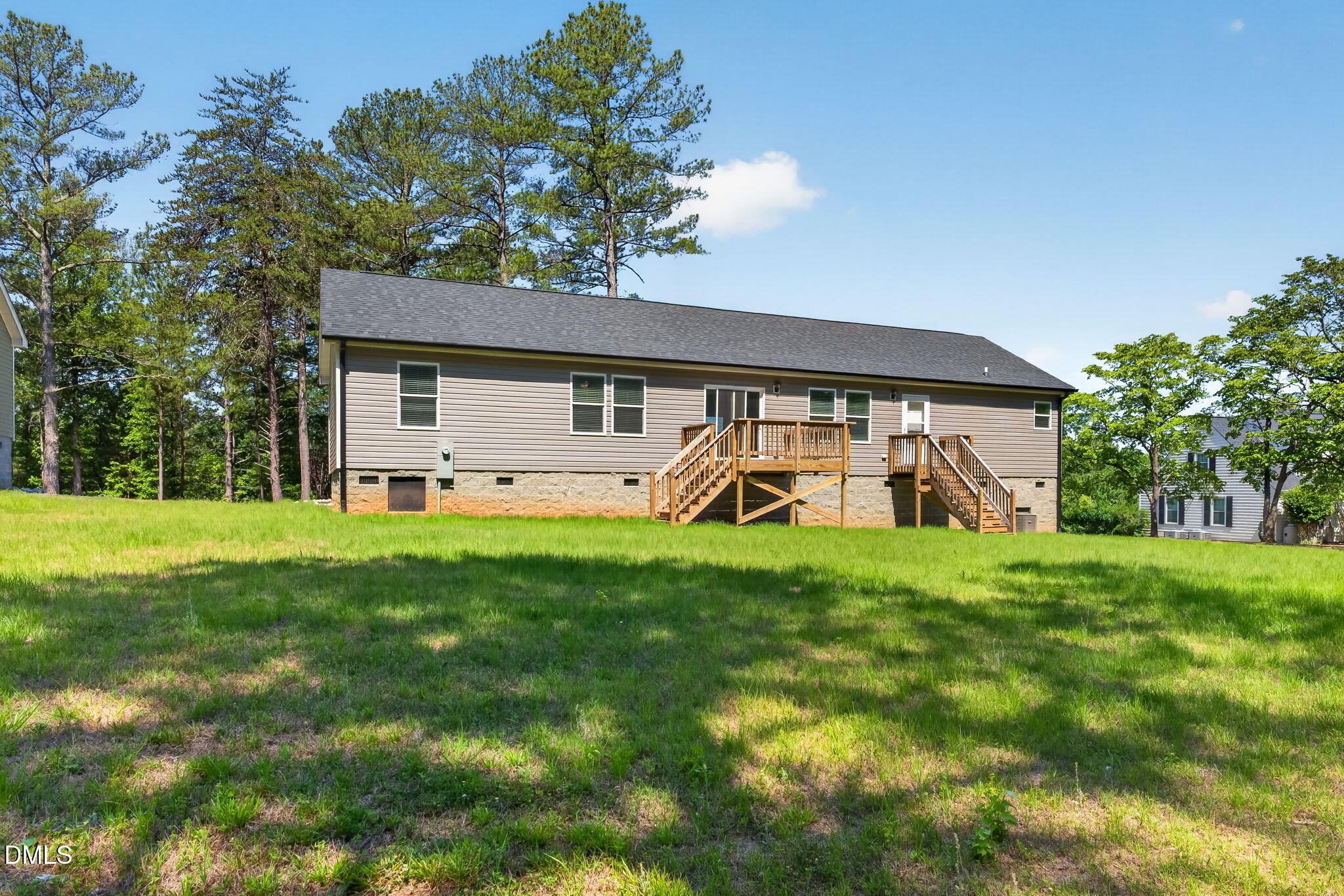 7122 Guess Road Hillsborough, NC 27278 - Photo 47 of 48 a view of a white house with a big yard plants and large trees
