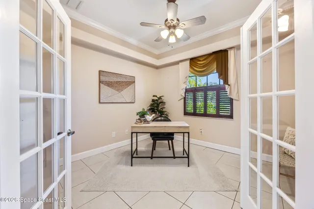 a view of an empty room with a ceiling fan