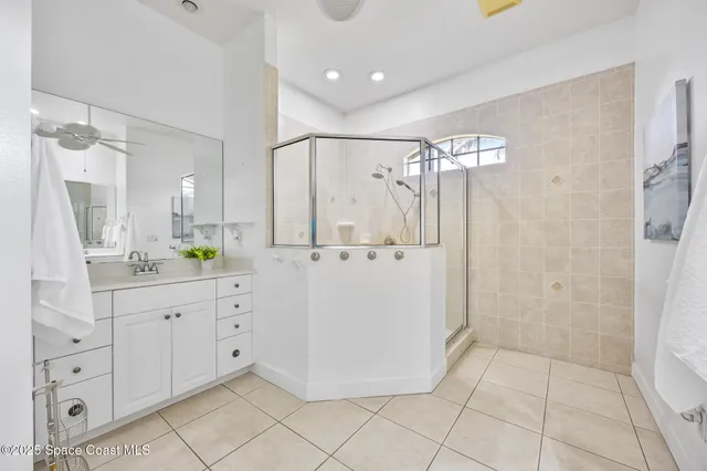 a bathroom with a granite countertop sink a toilet and bathtub