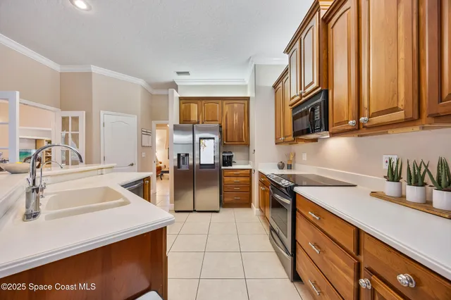a kitchen with stainless steel appliances granite countertop a sink and cabinets