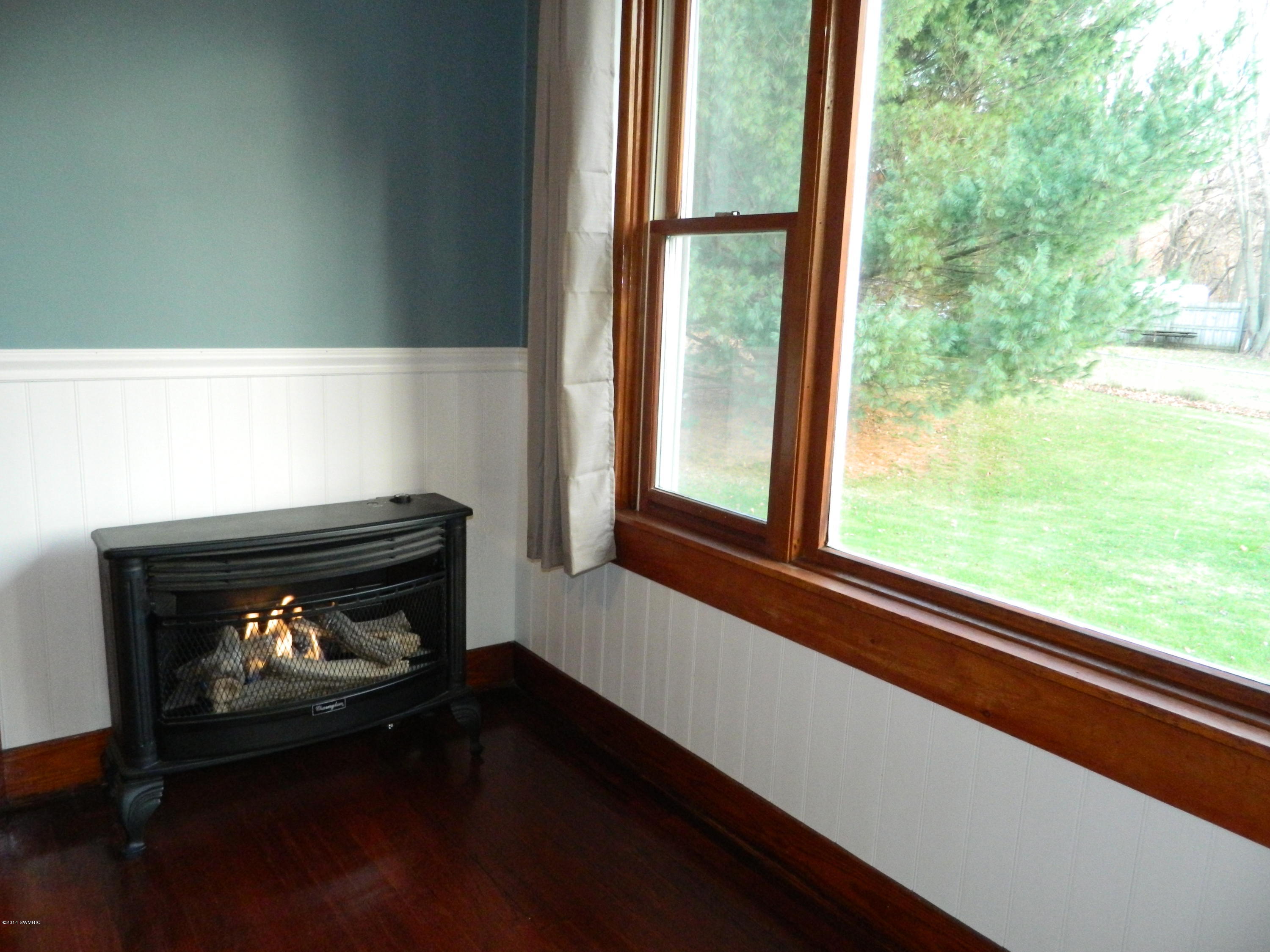 1034 South Constantine Street Three Rivers, MI 49093 - Photo 4 of 11 Fireplace in Dining Room