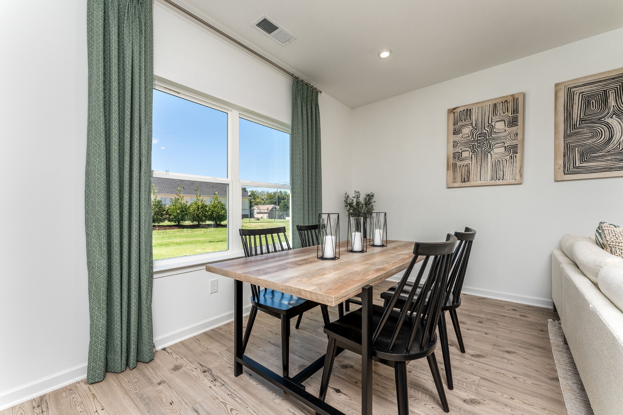 1116 Southerlynn Drive White House, TN 37188 - Photo 6 of 18 a view of a dining room with furniture window and wooden floor