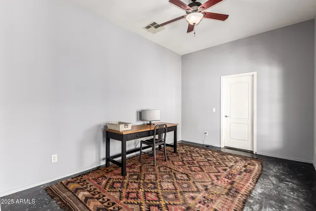 a view of a workspace with furniture