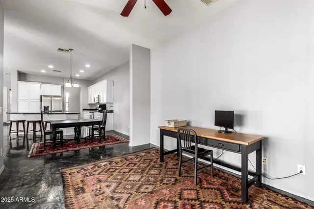 a view of a workspace with furniture