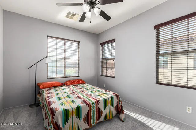 a bedroom with a bed and window