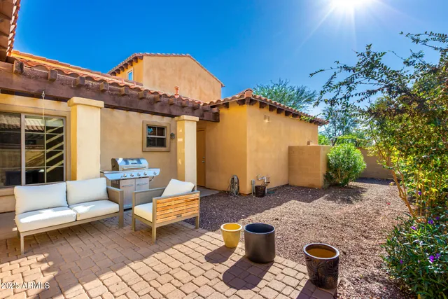 a backyard of a house with seating space