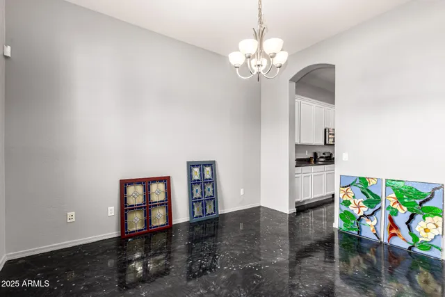a living room with stainless steel appliances furniture and decor
