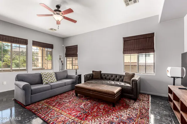 a living room with furniture and a window