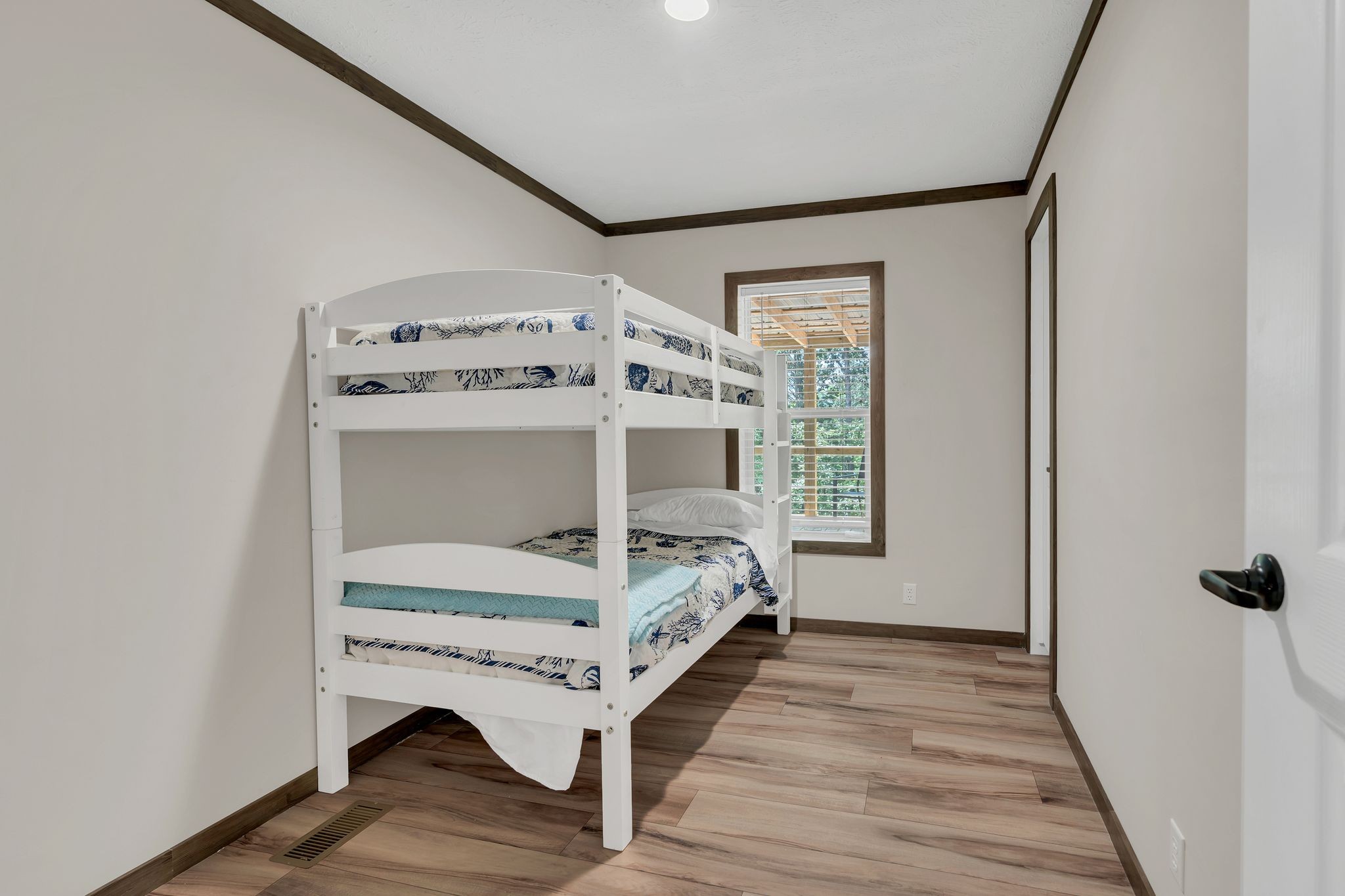 351 Wismer Road Camden, TN 38320 - Photo 15 of 27 a bedroom with a bed and a window