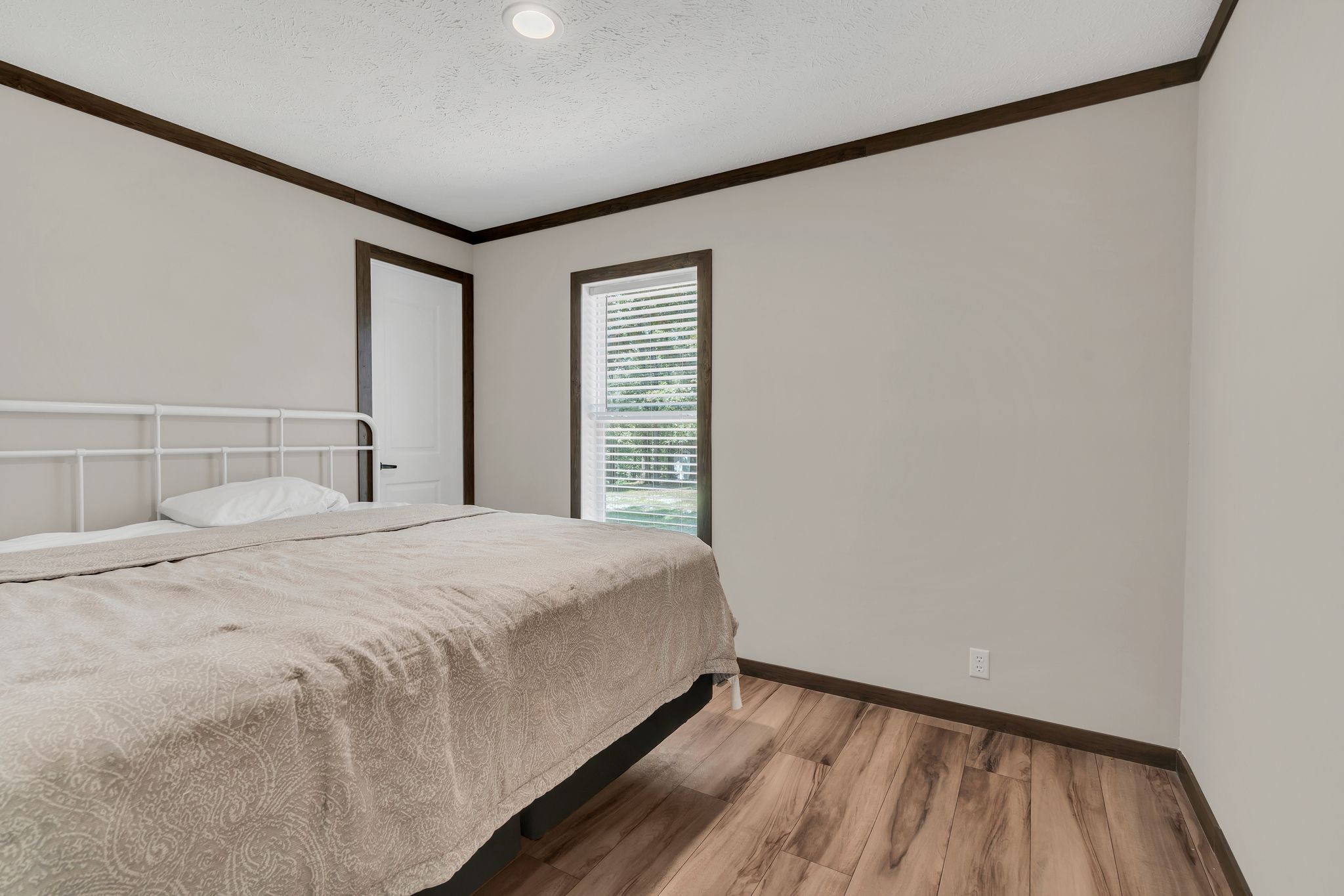 351 Wismer Road Camden, TN 38320 - Photo 17 of 27 a bedroom with a bed and a window